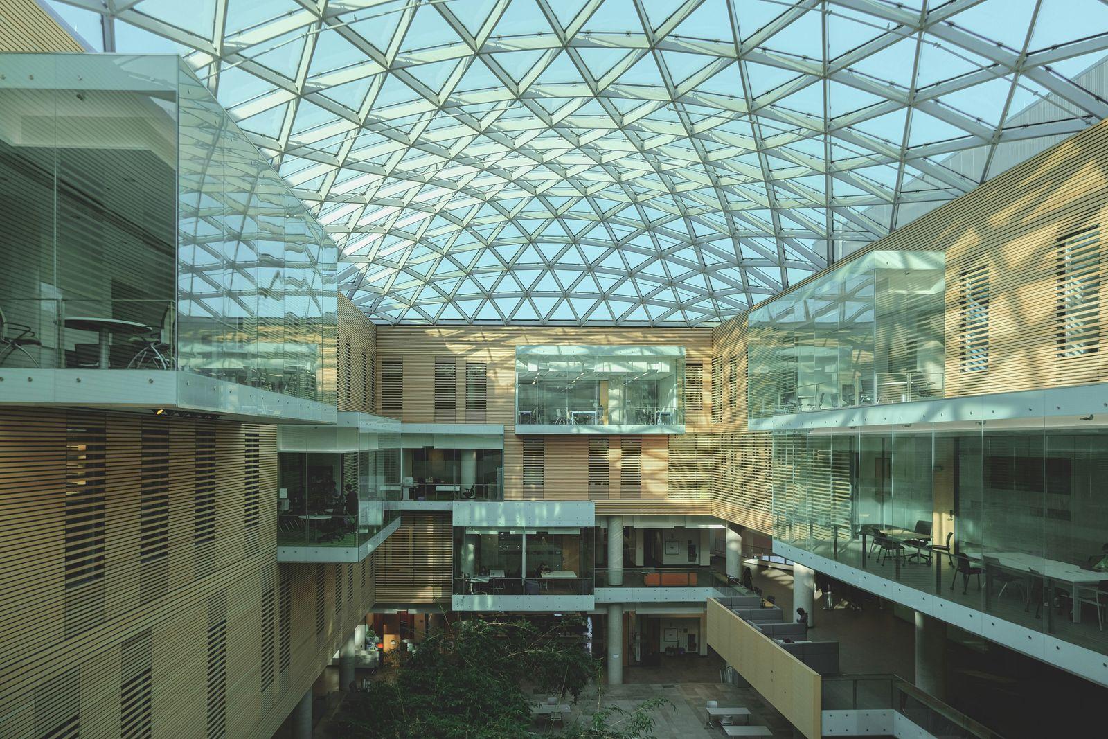 A bright, modern building with a glass ceiling.