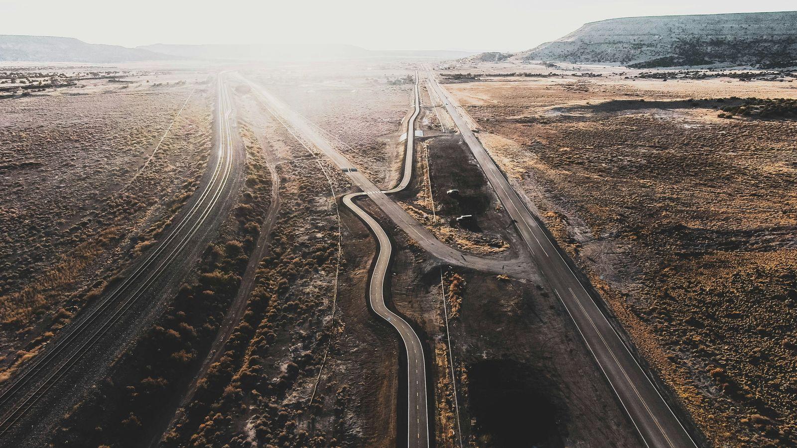 an aerial view of a road in the middle of nowhere